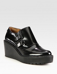 Dual metal tab closures contrast against this leather silhouette on an elevated wedge. Rubber heel, 2¾ (70mm)Rubber platform, 1 (25mm)Compares to a 1¾ heel (45mm)Leather upperLeather liningRubber trek solePadded insoleImportedOUR FIT MODEL RECOMMENDS ordering one half size up as this style runs small. Dual metal tab closures contrast against this leather silhouette on an elevated wedge. Rubber heel, 2¾ (70mm)Rubber platform, 1 (25mm)Compares to a 1¾ heel (45mm)Leather upperLeather liningRubber trek solePadded insoleImportedOUR FIT MODEL RECOMMENDS ordering one half size up as this style runs small.