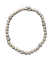 A couture collar necklace, by Lauren by Ralph Lauren. Elegant glass pearl (10 mm) is accented by crystal-encrusted nuggets of silvertone mixed metal. Approximate length: 18 inches. A couture collar necklace, by Lauren by Ralph Lauren. Elegant glass pearl (10 mm) is accented by crystal-encrusted nuggets of silvertone mixed metal. Approximate length: 18 inches.