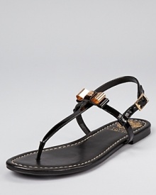 A charming pair of sandals from VINCE CAMUTO, adorned with a girlish bow made edgy by metal materials. A charming pair of sandals from VINCE CAMUTO, adorned with a girlish bow made edgy by metal materials.