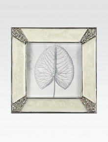 Masterful enameling has the look of lustrous mother-of-pearl in this elegant square frame with Swarovski crystals shimmering at each corner.Enamel and crystalWhite bronze finishHandmade, hand-enameled and hand-set2.75 square; holds a 2 square photoImported Masterful enameling has the look of lustrous mother-of-pearl in this elegant square frame with Swarovski crystals shimmering at each corner.Enamel and crystalWhite bronze finishHandmade, hand-enameled and hand-set2.75 square; holds a 2 square photoImported