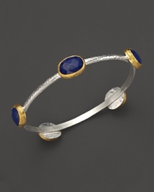 Lapis stations in 24K yellow gold bring vibrant style to this hammered sterling silver bangle from Gurhan. Lapis stations in 24K yellow gold bring vibrant style to this hammered sterling silver bangle from Gurhan.