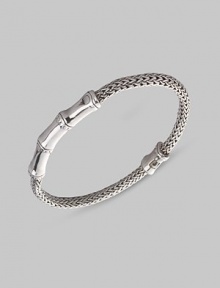 From the Bamboo Collection. A woven rope of sterling silver, accented by graceful bamboo-patterned stations. This Limited Edition design was expressly created to support an afforestation project on Nusa Penida, an arid island off the coast of Bali. For every purchase, John Hardy will donate 10% of the retail price to the cost of planting bamboo. This bracelet helped plant 5 bamboo seedlings. Sterling silver Length, about 7½ Push-lock clasp Made in Bali From the Bamboo Collection. A woven rope of sterling silver, accented by graceful bamboo-patterned stations. This Limited Edition design was expressly created to support an afforestation project on Nusa Penida, an arid island off the coast of Bali. For every purchase, John Hardy will donate 10% of the retail price to the cost of planting bamboo. This bracelet helped plant 5 bamboo seedlings. Sterling silver Length, about 7½ Push-lock clasp Made in Bali