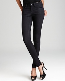 Supple leather back pockets toughen up these GUESS skinny jeans for a cool modern edge. Supple leather back pockets toughen up these GUESS skinny jeans for a cool modern edge.