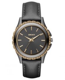 Dusky tones on rich leather blend with sparkling golden accents on this DKNY watch. Dusky tones on rich leather blend with sparkling golden accents on this DKNY watch.