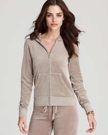 Ease into the season with a classic Juicy Couture terry hoodie, perfect for weekend lounging or layering over swimsuits for effortless summer style. Ease into the season with a classic Juicy Couture terry hoodie, perfect for weekend lounging or layering over swimsuits for effortless summer style.