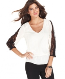 ECI contrasts colors and textures for this striking top, adorned with sheer black lace sleeves and a flattering blouson silhouette. (Clearance) ECI contrasts colors and textures for this striking top, adorned with sheer black lace sleeves and a flattering blouson silhouette. (Clearance)