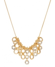 A shimmering mixture of golden rings lend an elegant look to this frontal necklace by Kenneth Cole New York. Crafted of gold tone mixed metal embellished with crystal accents. Approximate length: 16 inches + 3-inch extender. Approximate drop: 1-1/4 inches. A shimmering mixture of golden rings lend an elegant look to this frontal necklace by Kenneth Cole New York. Crafted of gold tone mixed metal embellished with crystal accents. Approximate length: 16 inches + 3-inch extender. Approximate drop: 1-1/4 inches.
