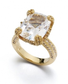 Accent your look with nearly 11 carats of sparkle! This head-turning Eliot Danori cocktail ring will shimmer as it catches the light. A cushion-cut cubic zirconia (10-5/8 ct. t.w.) and crystal side accents shine in an 18k gold over sterling silver setting. Sizes 5, 6, 7, 8, and 9. Accent your look with nearly 11 carats of sparkle! This head-turning Eliot Danori cocktail ring will shimmer as it catches the light. A cushion-cut cubic zirconia (10-5/8 ct. t.w.) and crystal side accents shine in an 18k gold over sterling silver setting. Sizes 5, 6, 7, 8, and 9.