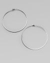 Make a quiet statement in these elegant hoop earrings. Silvertone metalLength, about 2.25Post closureImported 