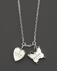 Embossed heart and butterfly charms dangle from an 18L sterling silver chain. From Gucci's Trademark collection. Embossed heart and butterfly charms dangle from an 18L sterling silver chain. From Gucci's Trademark collection.