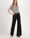 Stylish stripes meet a flattering silhouette with a comfortable, banded hem for a lovely blouse effect.BoatneckShort sleevesAllover stripesBanded hemAbout 27 from shoulder to hem88% rayon/12% spandexMachine washImported Model shown is 5'10 (177cm) wearing US size Small. 