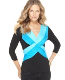 Brighten up with Cable & Gauge's twist-front top! The bold color pops against a background of flattering black. Brighten up with Cable & Gauge's twist-front top! The bold color pops against a background of flattering black.