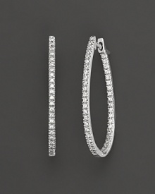 Prong set, inside out oval diamond hoop earrings set in white 14 Kt. gold. With hinged post. Prong set, inside out oval diamond hoop earrings set in white 14 Kt. gold. With hinged post.
