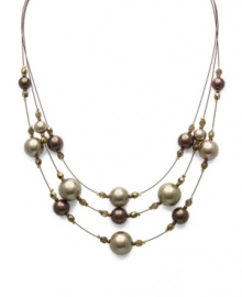Simulated pearls and beads in a beautiful brown palette are symmetrically arranged in Charter Club's three-row illusion necklace. Crafted in gold tone mixed metal. Approximate length: 17 to 20 inches + 1-1/2-inch extender. Simulated pearls and beads in a beautiful brown palette are symmetrically arranged in Charter Club's three-row illusion necklace. Crafted in gold tone mixed metal. Approximate length: 17 to 20 inches + 1-1/2-inch extender.