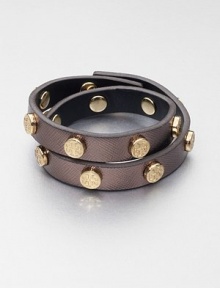 This coated saffiano leather design features a row of logo studs. Coated saffiano leatherGoldtoneLength, about 15.75Snap button closureImported This coated saffiano leather design features a row of logo studs. Coated saffiano leatherGoldtoneLength, about 15.75Snap button closureImported