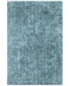 Add a pop of pure, shimmering blue to any modern room with the Metallic area rug from Dalyn. Hand-tufted of soft polyester, this high-luster shag area rug puts comfort and fun back in floor decor.