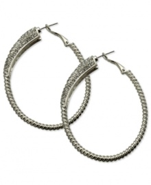 Sophistication reigns on these sparkling clutchless hoops from GUESS. Pave crystals adorn a classic earring silhouette. Crafted in silver tone mixed metal. Approximate drop: 2-1/4 inches. Sophistication reigns on these sparkling clutchless hoops from GUESS. Pave crystals adorn a classic earring silhouette. Crafted in silver tone mixed metal. Approximate drop: 2-1/4 inches.