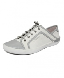 Leave your beat-up sneakers at home. Head out in casual style with the Nia sneakers by Calvin Klein, featuring bungee lacing and metallic accents.