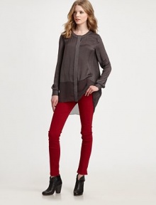 Shimmering, silk-like crewneck has a hidden button front, buttoned cuffs and a sheer hi-low hem. CrewneckLong sleeves with buttoned cuffsHidden button frontSemi-sheer hi-lo hemPolyester charmeuseDry cleanMade in USA of imported fabricModel shown is 5'10 (177cm) wearing US size Small. Shimmering, silk-like crewneck has a hidden button front, buttoned cuffs and a sheer hi-low hem. CrewneckLong sleeves with buttoned cuffsHidden button frontSemi-sheer hi-lo hemPolyester charmeuseDry cleanMade in USA of imported fabricModel shown is 5'10 (177cm) wearing US size Small.