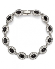 This Carolee bracelet styles your look with effortless elegance, accented by jet stone stations, specially faceted for added allure. This Carolee bracelet styles your look with effortless elegance, accented by jet stone stations, specially faceted for added allure.