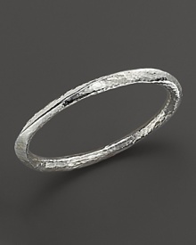 Hammered, faceted sterling silver bangle. Hammered, faceted sterling silver bangle.