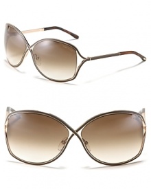 Tom Ford's chic oversized cross frames with openings at temple for a modern style. Tom Ford's chic oversized cross frames with openings at temple for a modern style.