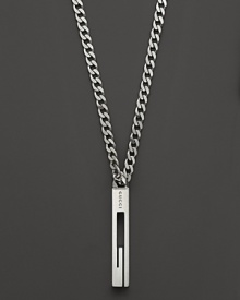 A sterling silver chain bears a Gucci logo pendant. A sterling silver chain bears a Gucci logo pendant.