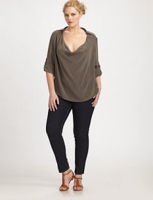 The epitome of feminine, a glamorously draped neckline meets a classic collar design and a flattering boxy fit is completed by a curved hem. Collar neckDraped frontButton-tab sleevesPull-on styleCurved hemPleat detail at back yokeAbout 29 from shoulder to hemSilkDry cleanImported The epitome of feminine, a glamorously draped neckline meets a classic collar design and a flattering boxy fit is completed by a curved hem. Collar neckDraped frontButton-tab sleevesPull-on styleCurved hemPleat detail at back yokeAbout 29 from shoulder to hemSilkDry cleanImported