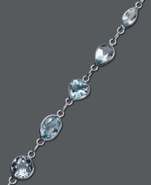 Let ocean-inspired color wash over you. Pretty round and oval-cut blue topaz gemstones (8 ct. t.w.) shine in a 14k white gold setting. Approximate length: 7 inches. Let ocean-inspired color wash over you. Pretty round and oval-cut blue topaz gemstones (8 ct. t.w.) shine in a 14k white gold setting. Approximate length: 7 inches.