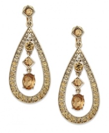 Make an entrance in these charming drops by Charter Club. The teardrop shaped is accented with topaz tone glass accents, while three stones drop at the center. Crafted in 14k gold-plated mixed metal. Approximate drop: 1-3/4 inches. Make an entrance in these charming drops by Charter Club. The teardrop shaped is accented with topaz tone glass accents, while three stones drop at the center. Crafted in 14k gold-plated mixed metal. Approximate drop: 1-3/4 inches.