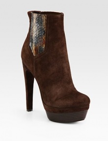 Wildly chic suede ankle boot has elastic side gores, genuine snakeskin print trim and a stacked platform. Self-covered heel, 5½ (140mm)Stacked platform, 1½ (40mm)Compares to a 4 heel (100mm)Suede, snakeskin print and elastic upperPull-on styleLeather lining and solePadded insoleImported Wildly chic suede ankle boot has elastic side gores, genuine snakeskin print trim and a stacked platform. Self-covered heel, 5½ (140mm)Stacked platform, 1½ (40mm)Compares to a 4 heel (100mm)Suede, snakeskin print and elastic upperPull-on styleLeather lining and solePadded insoleImported