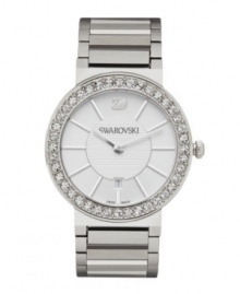 Clean, modern lines revolutionize the classic shape of this Citra watch by Swarovski. Stainless steel bracelet and round case. Bezel accented with crystal pave. White sunray dial features silver tone stick indices, date window at six o'clock, logo at twelve o'clock and two hands. Swiss quartz movement. Water resistant to 30 meters. Two-year limited warranty. Clean, modern lines revolutionize the classic shape of this Citra watch by Swarovski. Stainless steel bracelet and round case. Bezel accented with crystal pave. White sunray dial features silver tone stick indices, date window at six o'clock, logo at twelve o'clock and two hands. Swiss quartz movement. Water resistant to 30 meters. Two-year limited warranty.