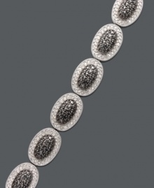 Revel in luxurious links. This oval-shaped bracelet features sparkling black diamonds (1/4 ct. t.w.) and white diamonds (1/4 ct. t.w.) brought together for chic contrast. Set in sterling silver. Approximate length: 7-1/4 inches. Revel in luxurious links. This oval-shaped bracelet features sparkling black diamonds (1/4 ct. t.w.) and white diamonds (1/4 ct. t.w.) brought together for chic contrast. Set in sterling silver. Approximate length: 7-1/4 inches.