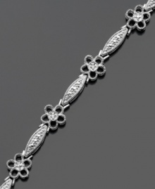 Give your style a boost with this cheerful flower bracelet featuring sparkling diamond accents. Victoria Townsend design crafted in sterling silver. Approximate length: 7 inches. Give your style a boost with this cheerful flower bracelet featuring sparkling diamond accents. Victoria Townsend design crafted in sterling silver. Approximate length: 7 inches.