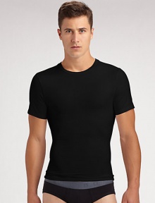 The classic crew is redefined in high-stretch cotton that firms the chest as it flattens the stomach. Crewneck Improves posture Supports lower back No bulk under clothing Tapered shape 81% cotton/19% spandex; machine wash Imported The classic crew is redefined in high-stretch cotton that firms the chest as it flattens the stomach. Crewneck Improves posture Supports lower back No bulk under clothing Tapered shape 81% cotton/19% spandex; machine wash Imported