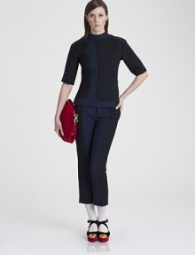 Utterly modern, this sleek sculptural style is impeccably tailored from a luxe silk/wool blend.Modified mock neckShort sleevesPanel constructionConcealed back zip50% silk/50% woolDry cleanMade in Italy of imported fabricModel shown is 5'11 (180cm) wearing US size 4. Utterly modern, this sleek sculptural style is impeccably tailored from a luxe silk/wool blend.Modified mock neckShort sleevesPanel constructionConcealed back zip50% silk/50% woolDry cleanMade in Italy of imported fabricModel shown is 5'11 (180cm) wearing US size 4.