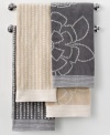 A breath of fresh air. Martha Stewart Collection revives your bathroom in carefree style with this Calendula hand towel, featuring either a stripe or floral pattern in two neutral hues.