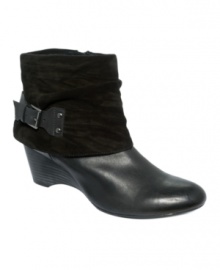 Clarks' Artisan Trolly Twirl booties will set off your look with it's terrific cuff and back buckle wrap. Clarks' Artisan Trolly Twirl booties will set off your look with it's terrific cuff and back buckle wrap.