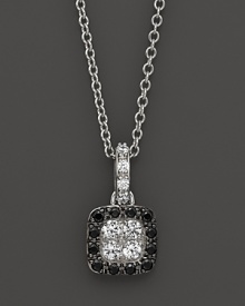 Black and white diamonds in a 14K. white gold setting. Black and white diamonds in a 14K. white gold setting.