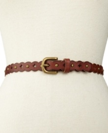 A feminine scalloped design blends with subtle perforations and studs on this thin leather belt from Fossil. A feminine scalloped design blends with subtle perforations and studs on this thin leather belt from Fossil.