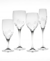 An etched floral motif puts a whimsical spin on this fine crystal wine glass. A luminous stem segues gracefully from base to bowl, creating a clean, timeless silhouette. (Clearance)