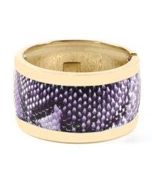 Slither into a little something stylish. Haskell's chic cuff bracelet features a gold tone mixed metal setting with a strip of purple snake print. Hinged design slips easily over the wrist. Approximate length: 8 inches. Slither into a little something stylish. Haskell's chic cuff bracelet features a gold tone mixed metal setting with a strip of purple snake print. Hinged design slips easily over the wrist. Approximate length: 8 inches.