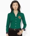 Lauren Jeans Co.'s soft cotton broadcloth shirt is accented with rich heritage details, finished with tie-striped silk at the collar and an embroidered crest at the chest.