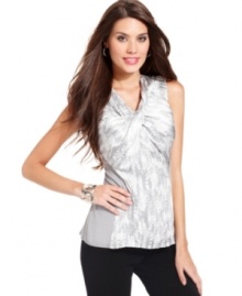 Alfani's sleeveless blouse features a unique twist detail at the neckline, a snake-inspired print, an exposed back zipper and a contrasting side and back panel. Alfani's sleeveless blouse features a unique twist detail at the neckline, a snake-inspired print, an exposed back zipper and a contrasting side and back panel.