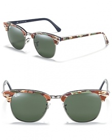 Rimless wayfarer sunglasses with camouflage accents for a tough girl style. Rimless wayfarer sunglasses with camouflage accents for a tough girl style.