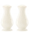 With fanciful beading and a feminine edge, Lenox French Perle salt and pepper shakers have an irresistibly old-fashioned sensibility. Hard-wearing stoneware is dishwasher safe and, in a soft white hue with antiqued trim, a graceful addition to any meal.