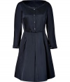 Luxurious dress in fine navy blue satin silk - Elegant design - Narrow top, with wide round neck, button placket and long blouse sleeves - The silhouette is drawn from the waist and jumps in decorative lines - Wear with heels or flats