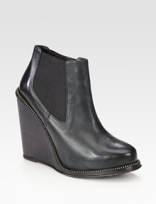 Street-cool leather design on a powerful stacked wedge with edgy zipper trim. Stacked wedge, 4½ (115mm)Leather upper with zipper trim and side elastic goresPull-on styleLeather lining and solePadded insoleImported Street-cool leather design on a powerful stacked wedge with edgy zipper trim. Stacked wedge, 4½ (115mm)Leather upper with zipper trim and side elastic goresPull-on styleLeather lining and solePadded insoleImported