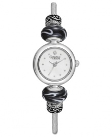Moody black beads and crystal shimmer make this bangle watch from Caravelle by Bulova an intriguing addition to your collection. Moody black beads and crystal shimmer make this bangle watch from Caravelle by Bulova an intriguing addition to your collection.