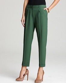 Embrace a menswear approach to your 9-to-5 look with pleated Jones New York Collection trousers. Accentuate the cropped, cuffed leg line with polished pumps for the perfect girl-meets-boy style mix. Embrace a menswear approach to your 9-to-5 look with pleated Jones New York Collection trousers. Accentuate the cropped, cuffed leg line with polished pumps for the perfect girl-meets-boy style mix.